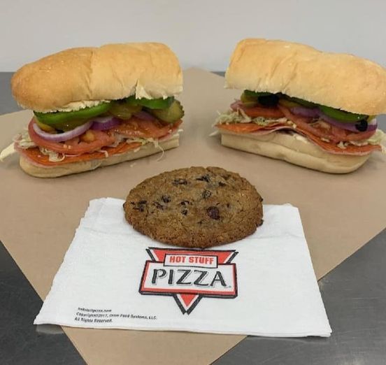 Sub from Chopz and cookie with Hot Stuff Pizza napkin offered at Timberline Sports-N-Convenience